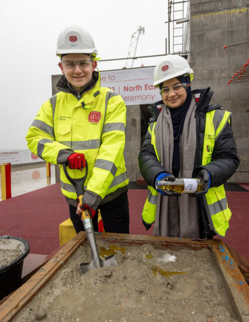 Apprentices talking in a new building