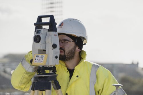 Two people talking at a desk