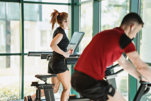 two people working out at the gym